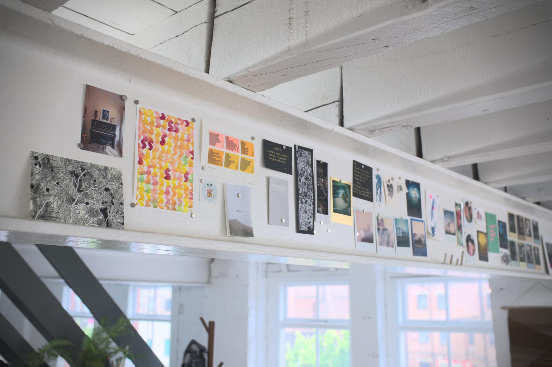 Some of the prints, postcards and plots that decorate the beams in the studio